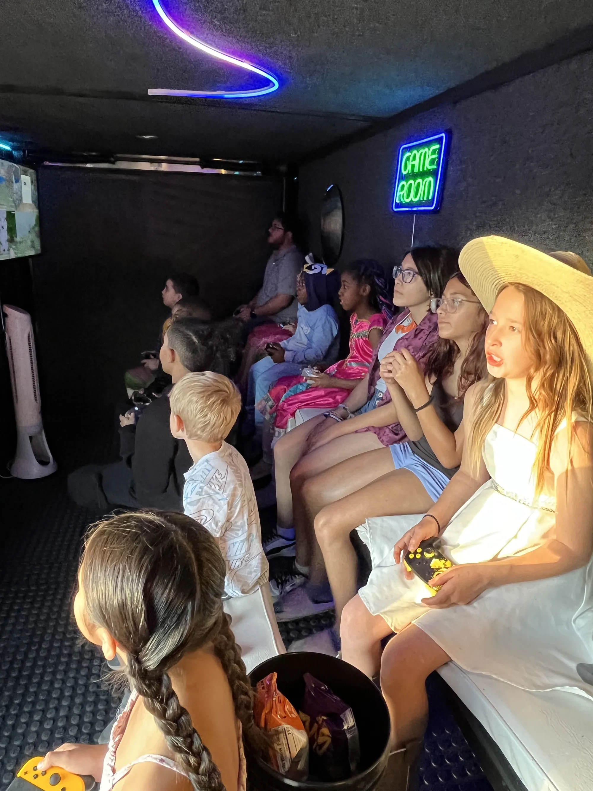 Guests in colorful costumes enjoying games together