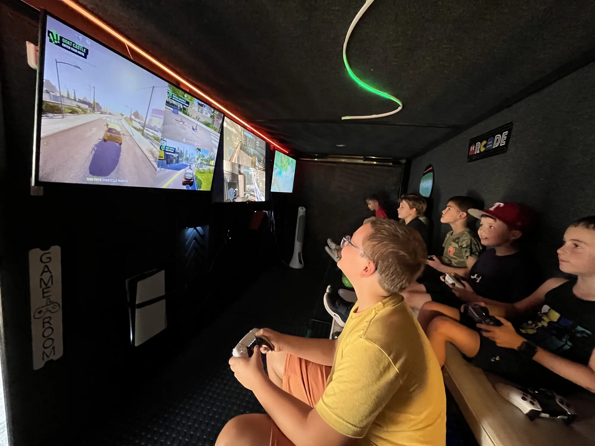 Party guests racing together on the big screens