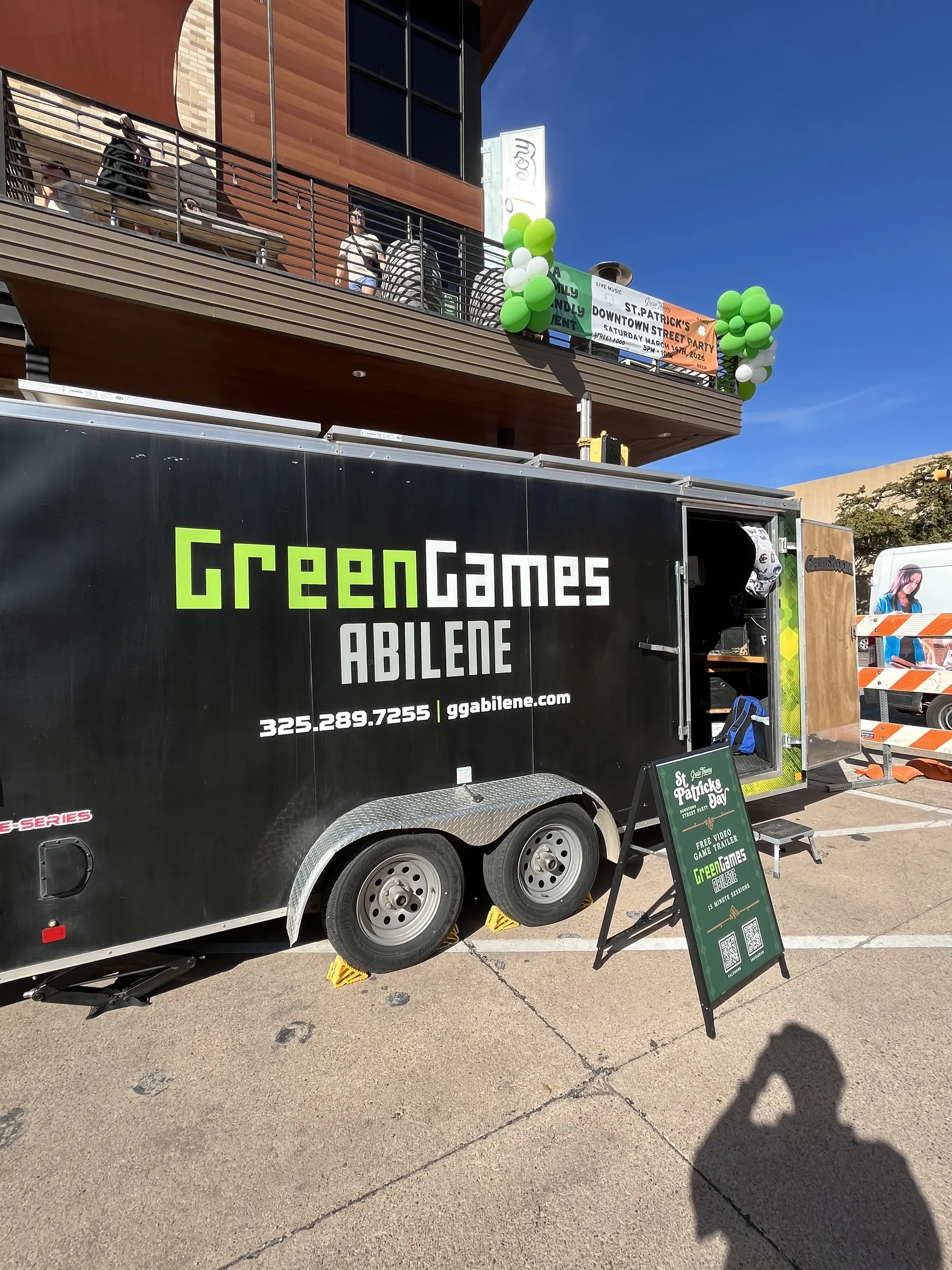 Green Games trailer at a sunny downtown celebration